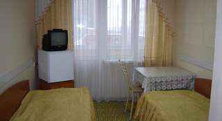 Гостиница БИЦ Тюмень Кровать в общем номере с 3 кроватями-1