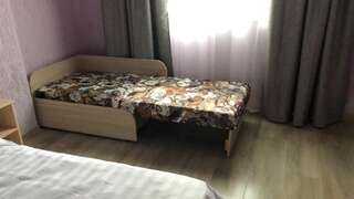 Фото номер Лаванда Двухместный номер с 2 отдельными кроватями и дополнительной кроватью